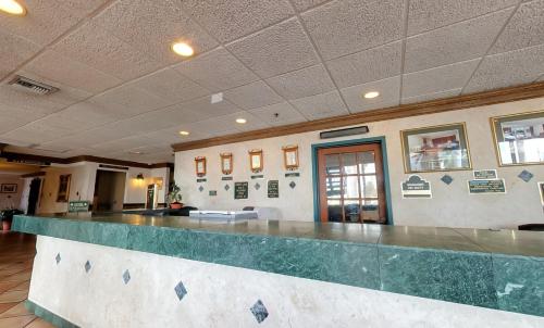 a lobby with a large counter in a building at Miami Gardens Inn & Suites in Miami
