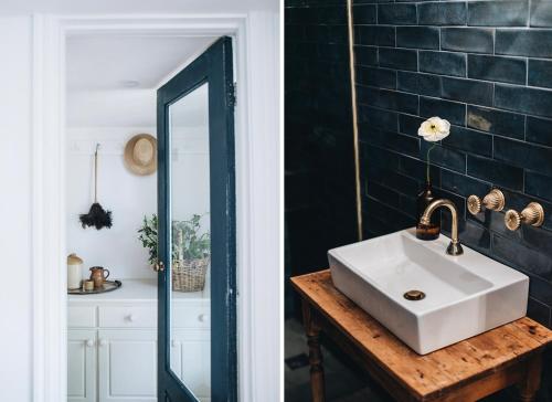 a bathroom with a white sink and a mirror at The Garden Loft at Poets Lodge in Daylesford