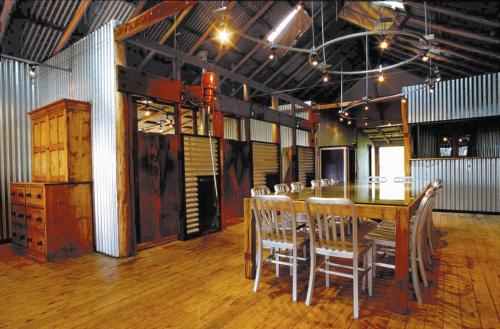 a dining room with a table and chairs at Black Sheep Inn in Orange