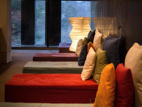 a group of pillows sitting on top of a couch at Wataya Besso in Ureshino