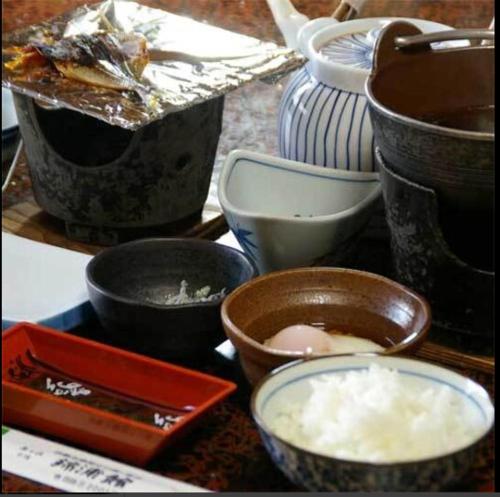 a group of bowls and dishes on a table at Kinpokan in Toba