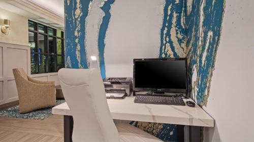 a desk with a computer on top of it at Best Western Woodland Hills in Woodland Hills