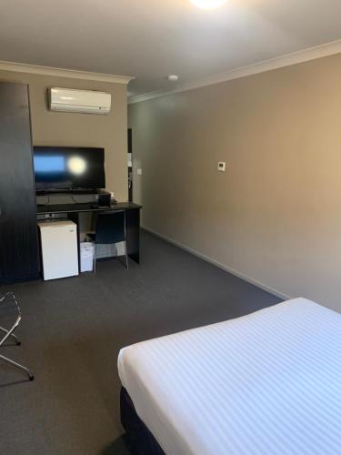 Ένα ή περισσότερα κρεβάτια σε δωμάτιο στο Best Western Blackbutt Inn
