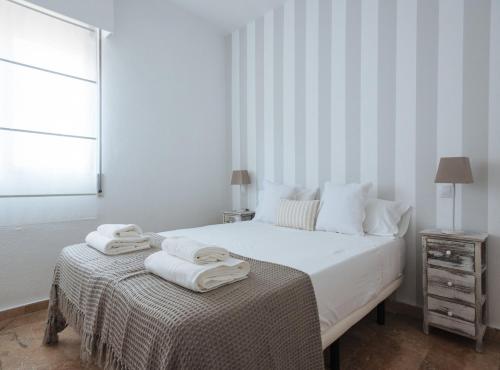 Cama o camas de una habitación en Bright Apartment in the Heart of Seville