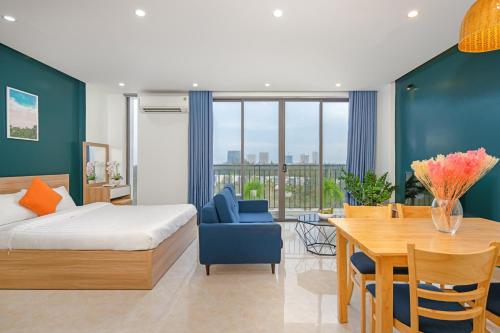 Ένα ή περισσότερα κρεβάτια σε δωμάτιο στο Suri Apartment & Hotel Danang