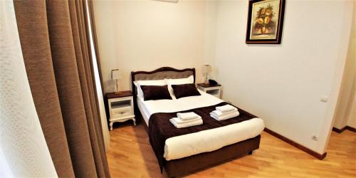 Ένα ή περισσότερα κρεβάτια σε δωμάτιο στο Hotel Meridian