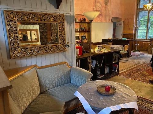 a living room with a couch and a table at Loft Chupferhammer & Loft Factory in Ober-Bazenheid