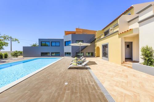 4 bedrooms house with sea view shared pool and enclosed garden at Quelfes