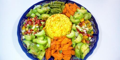 a blue bowl filled with different types of vegetables at Riad Dades Birds in Boumalne
