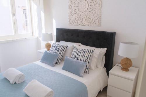 Cama o camas de una habitación en Living Coimbra Corpo de Deus