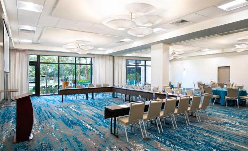 a conference room with a long table and chairs at EVEN Hotel Miami - Airport by IHG in Miami