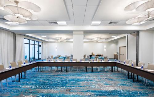 a conference room with a long table and chairs at EVEN Hotel Miami - Airport by IHG in Miami