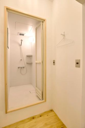 a bathroom with a mirror and a shower at HIKE in Nirasaki