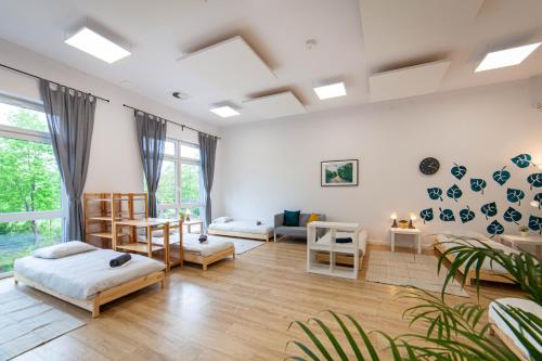 a living room with a bed and a couch at Hostel Montessori in Gdańsk