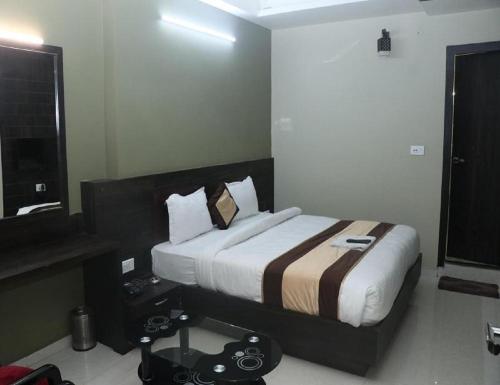 Ένα ή περισσότερα κρεβάτια σε δωμάτιο στο Hotel Pratap Iinternational