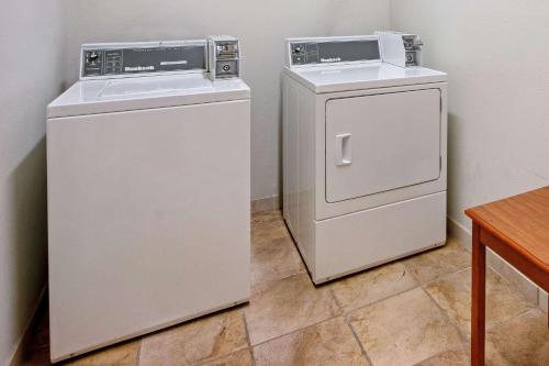 two washing machines sitting next to each other in a room at La Quinta by Wyndham Ruidoso Downs in Ruidoso Downs
