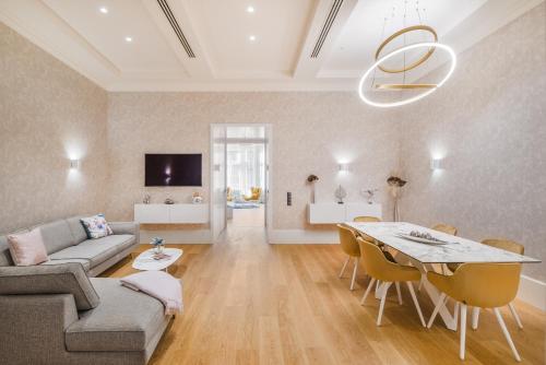 a living room with a couch and a table at Hotel Vision Budapest by Continental Group in Budapest