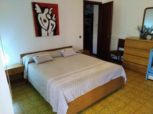 トルヴァイアニカにあるCa' Ginevraのベッドルーム1室(大型ベッド1台付)