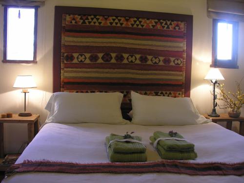 
A bed or beds in a room at Ipacaa Lodge
