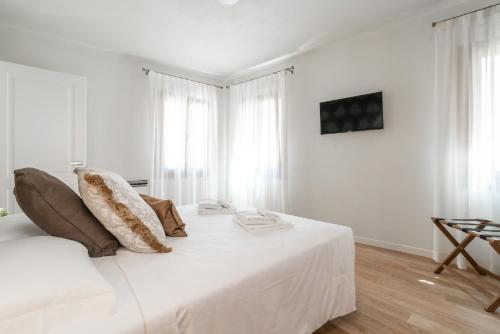 Letto o letti in una camera di Hotel Grifoni