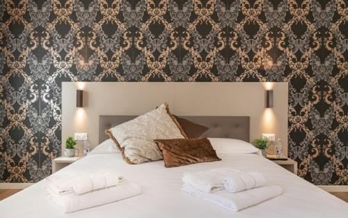 Letto o letti in una camera di Hotel Grifoni