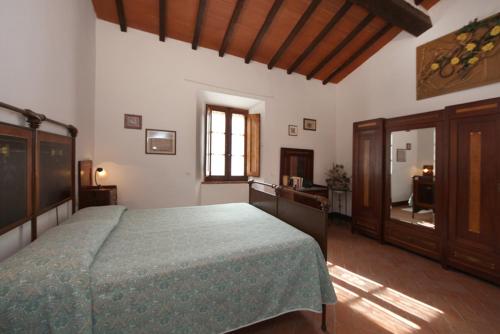 Postel nebo postele na pokoji v ubytování Agriturismo Torrenieri da Alessandro