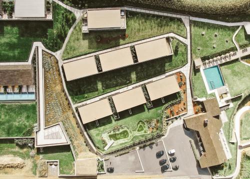 an overhead view of a park with a building at Santa Barbara Eco-Beach Resort in Ribeira Grande