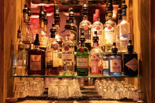 a bar with many bottles and glasses of alcohol at Durty Nelly's Inn in Amsterdam
