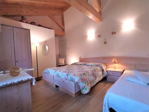 Postel nebo postele na pokoji v ubytování B&B Dolomitincanto