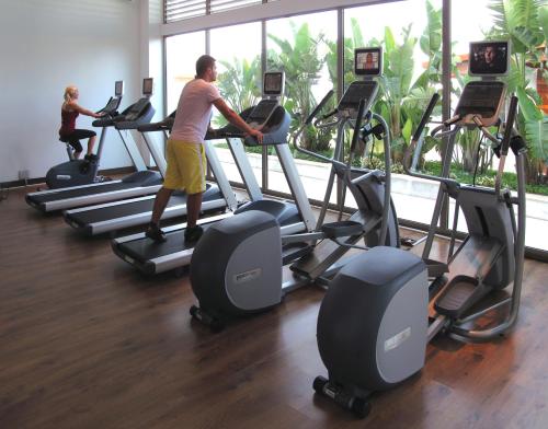 a man exercising on a treadmill in a gym at Hillstone Bodrum Hotel & Spa in Bodrum City