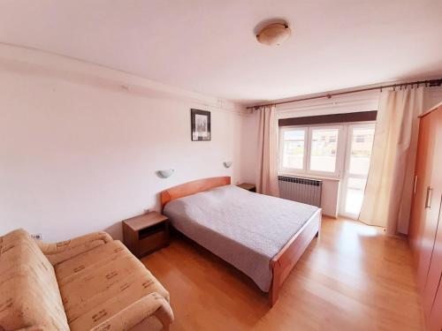 מיטה או מיטות בחדר ב-Apartments Mužić Cres II