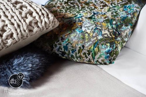 a close up of a pillow and a throw pillow sidx sidx sidx at Mittermeiers Alter Ego in Rothenburg ob der Tauber