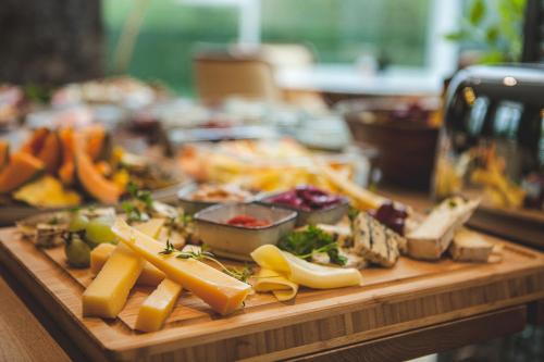 a cutting board filled with different types of food at A Hotels Glostrup in Glostrup