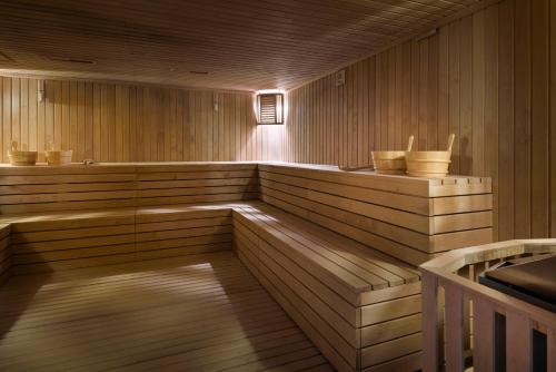 an empty sauna with a wooden floor at Voco - Riyadh by IHG in Riyadh