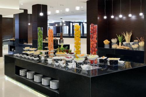 a buffet of food on display in a building at Voco - Riyadh by IHG in Riyadh