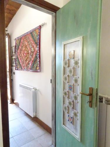 a door to a hallway with a rug on the wall at B&B Villa San Marco in Agrigento