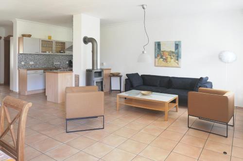 a living room with a couch and a table at Ferien in Himmelpfort in Himmelpfort