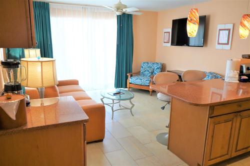 a large living room with a couch and a living room at Glunz Ocean Beach Hotel and Resort in Marathon
