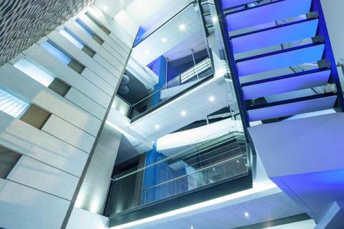 an image of a building with escalators at Inntu Hotel in Medellín