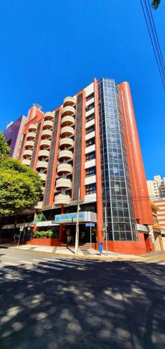 a large red building with windows on a street at Hotel Dan Inn Campinas Cambuí - Um Hotel Clássico em Campinas By Nacional Inn in Campinas