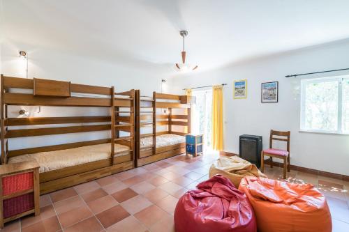 a room with two bunk beds and a couch at Villa near the beach and Lagos Marina #1868 in Lagos