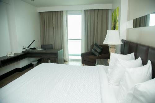 Cama o camas de una habitación en Mercure Macae