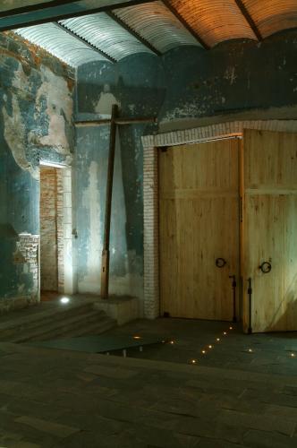 an empty room with two doors in a building at La Purificadora, Puebla, a Member of Design Hotels in Puebla