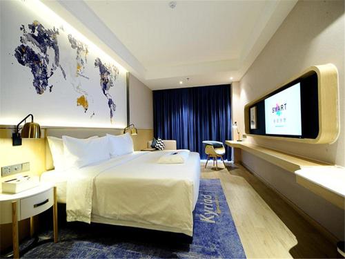 Postel nebo postele na pokoji v ubytování KyriadChina Changsha the zone of environment protection hotel