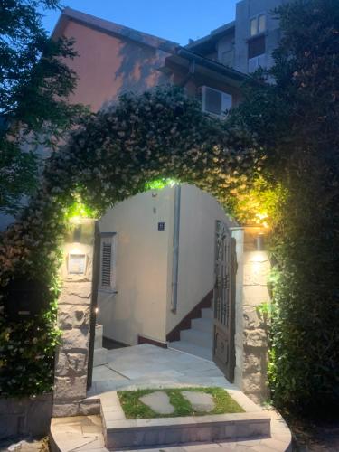 an archway with an entrance to a building with a gate at Apartments Amigo in Kotor