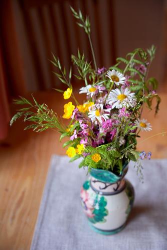 a vase filled with flowers sitting on a table at Vordergugg in Mittersill