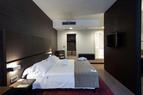 Postel nebo postele na pokoji v ubytování Best Western Plus Hotel Monza e Brianza Palace