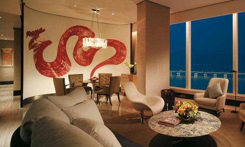 a living room with a couch and a table at MGM Macau in Macau