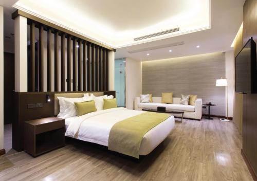 Ένα ή περισσότερα κρεβάτια σε δωμάτιο στο The Marison Hotel