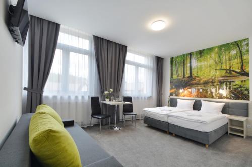 Postel nebo postele na pokoji v ubytování Hotel Roztocze